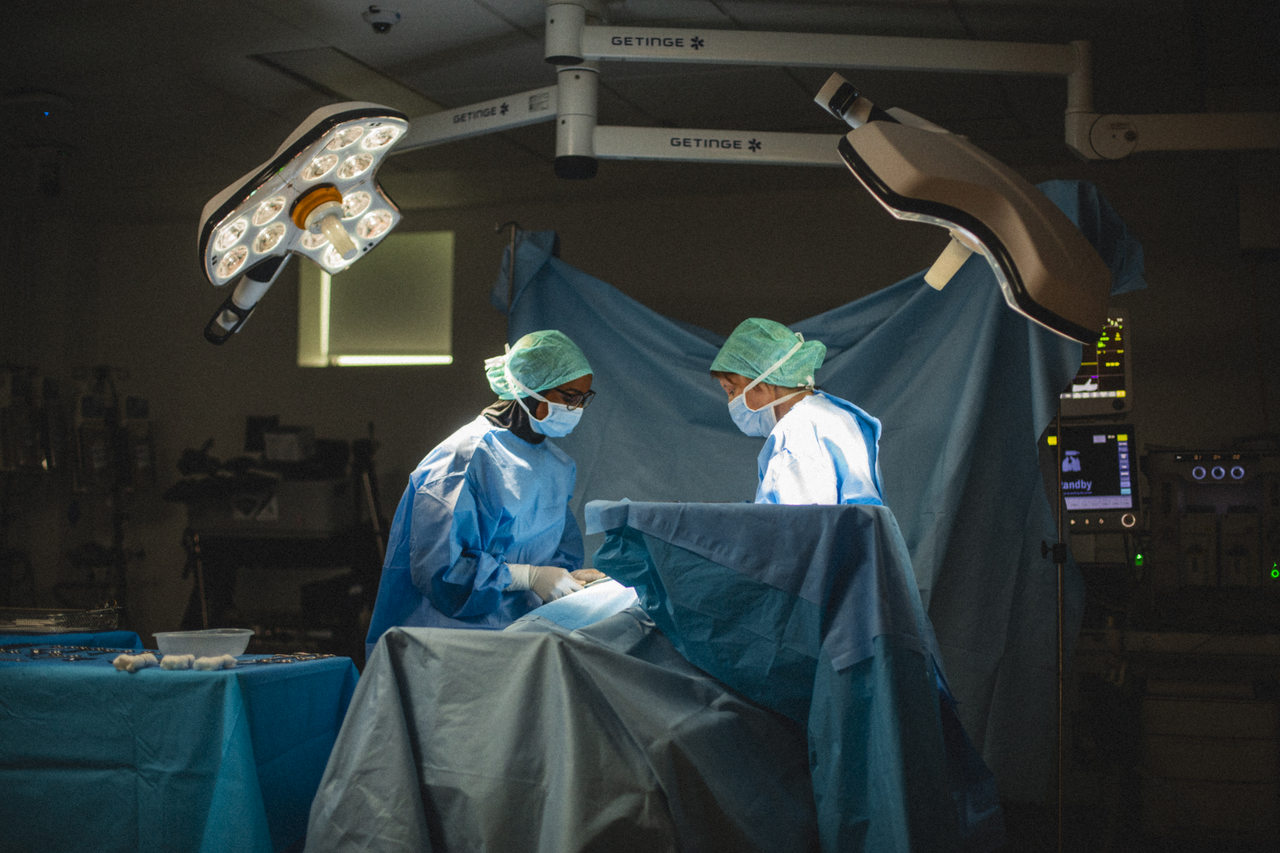 Two operating Department Practice Students work in a mock operating theatre