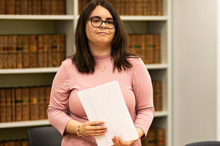 A student stood in a law classroom