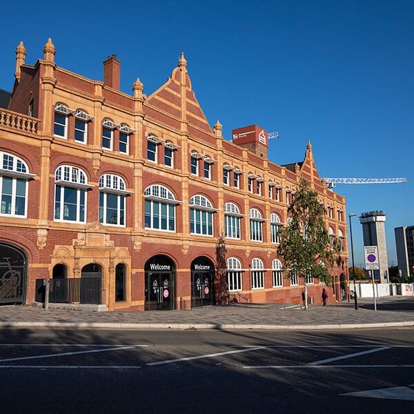 Exterior shot of the STEAMhouse building on a sunny day