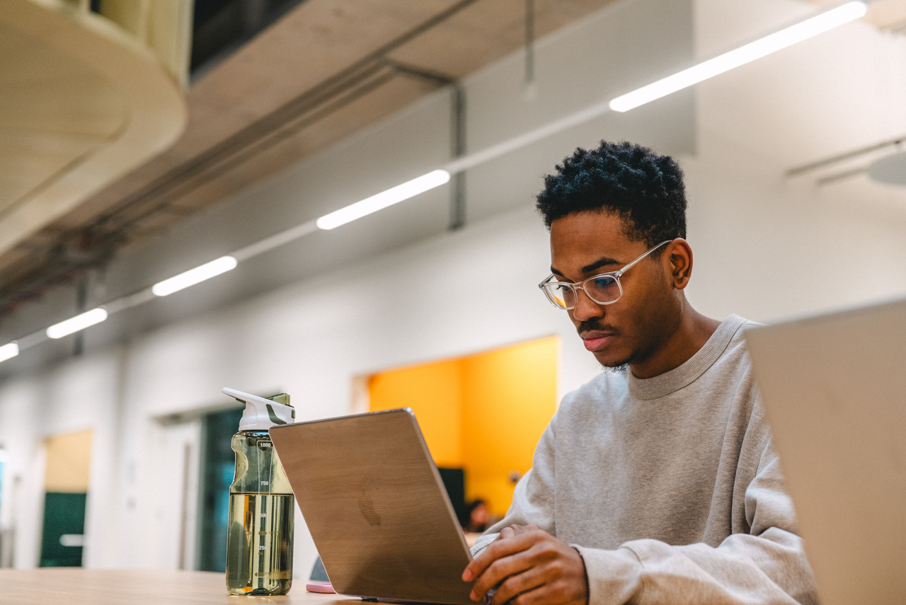 A student studying on a laptop