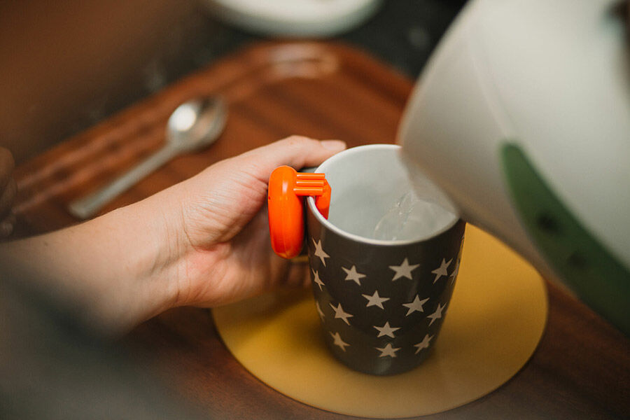 Rehabilitation activity in Seacole building - pouring water from a kettle