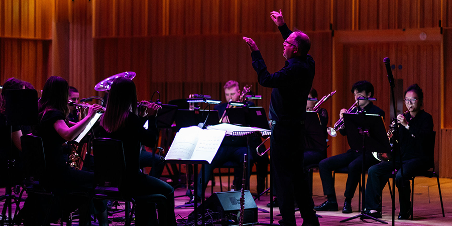 A man leading a concert at the Royal Birmingham Conservatoire