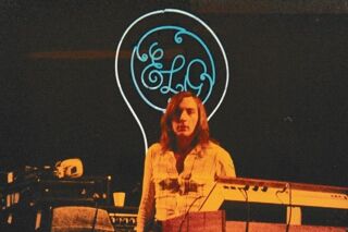 Synthesiser and keyboard player Richard Tandy on stage with ELO.