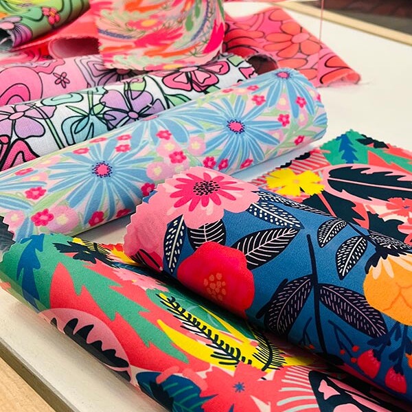 Rolls of colourful patterned fabric from MA Textile and Surface Design