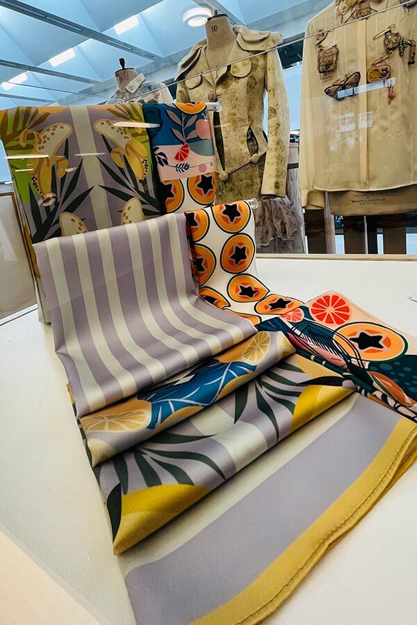 Rolls of patterned fabric with mannequins from MA Textile and Surface Design