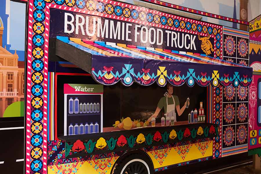 A colourful food truck with the name "Brummie Food Truck" painted on the side