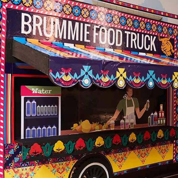 A colourful food truck with the name "Brummie Food Truck" painted on the side