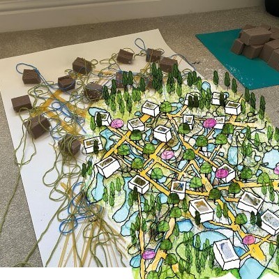 Blocks representing buildings, with drawings overlayed on top