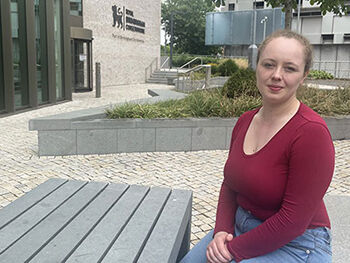 Alumna Samantha Oxborough will perform at the opening event of the Birmingham Festival 23 to mark the one-year anniversary of the 2022 Commonwealth Games. Sam Oxborough sat on a bench outside the back of Royal Birmingham Conservatoire