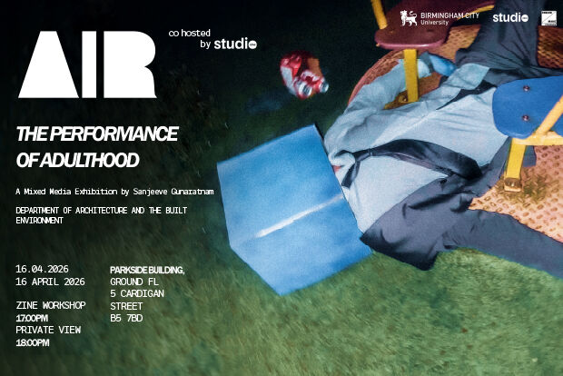 Man in a suit with a blue cube on head lying face up on grass at night