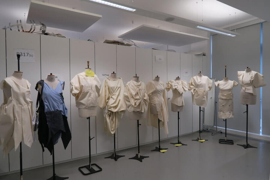 A group of mannequins dressed in student work