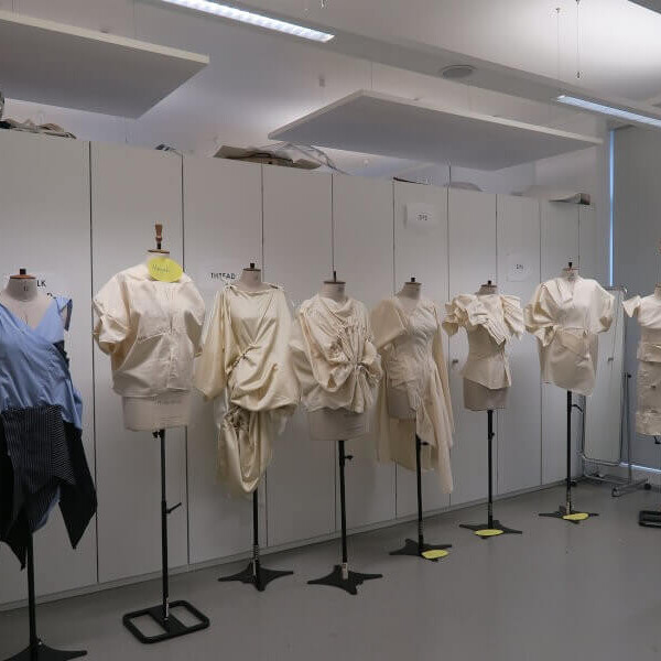 A group of mannequins dressed in student work