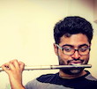 Arjun Jethwa alumnus playing flute