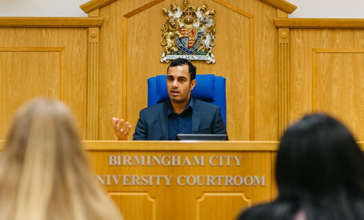 Law School - News - ATD - See Out Kit Image 530x320 (Man sat in the mock crown court)