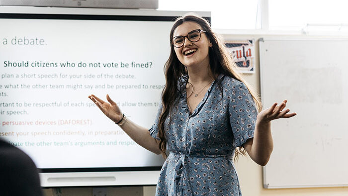 Teacher presenting at the front of classroom