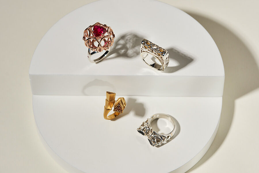 Four rings created by student, ranging in style and colour