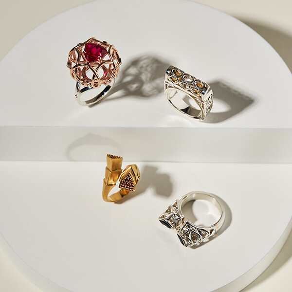 Four rings created by student, ranging in style and colour