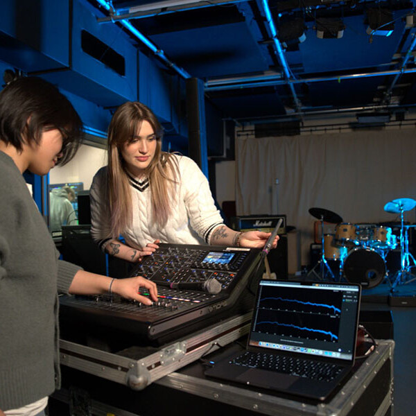 Students on computer working on sound engineering