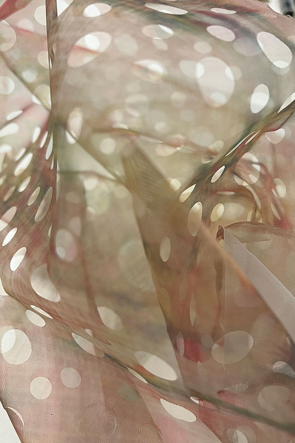 Spotty light fabric billowing from MA Textile and Surface Design