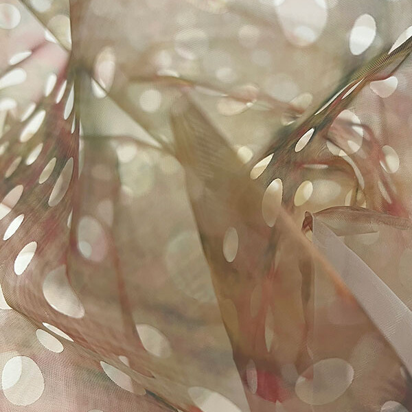 Spotty light fabric billowing from MA Textile and Surface Design