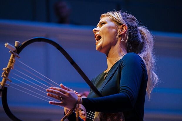 Musician and academic Stef Conner playing a lyre