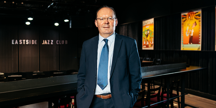 Stephen Maddock stood smiling at Eastside Jazz Club