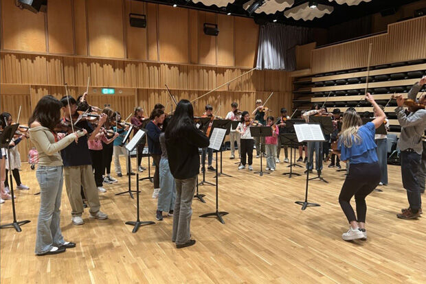 Large group of young string players