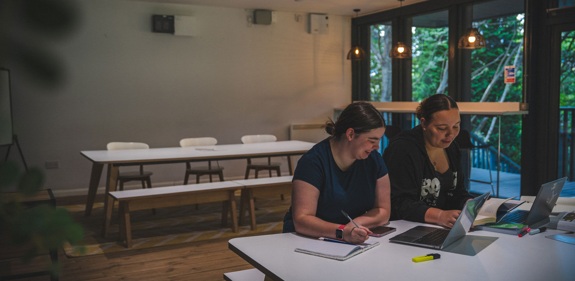 Two students studying in Beech Gardens accommodation study room