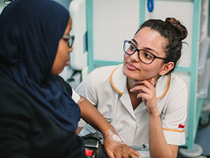 Healthcare student working with young person