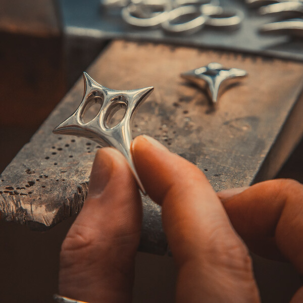 Student creating a broach