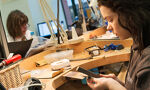 BCU Jewellery student filing a piece.