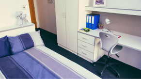 Bed and desk in a bedroom