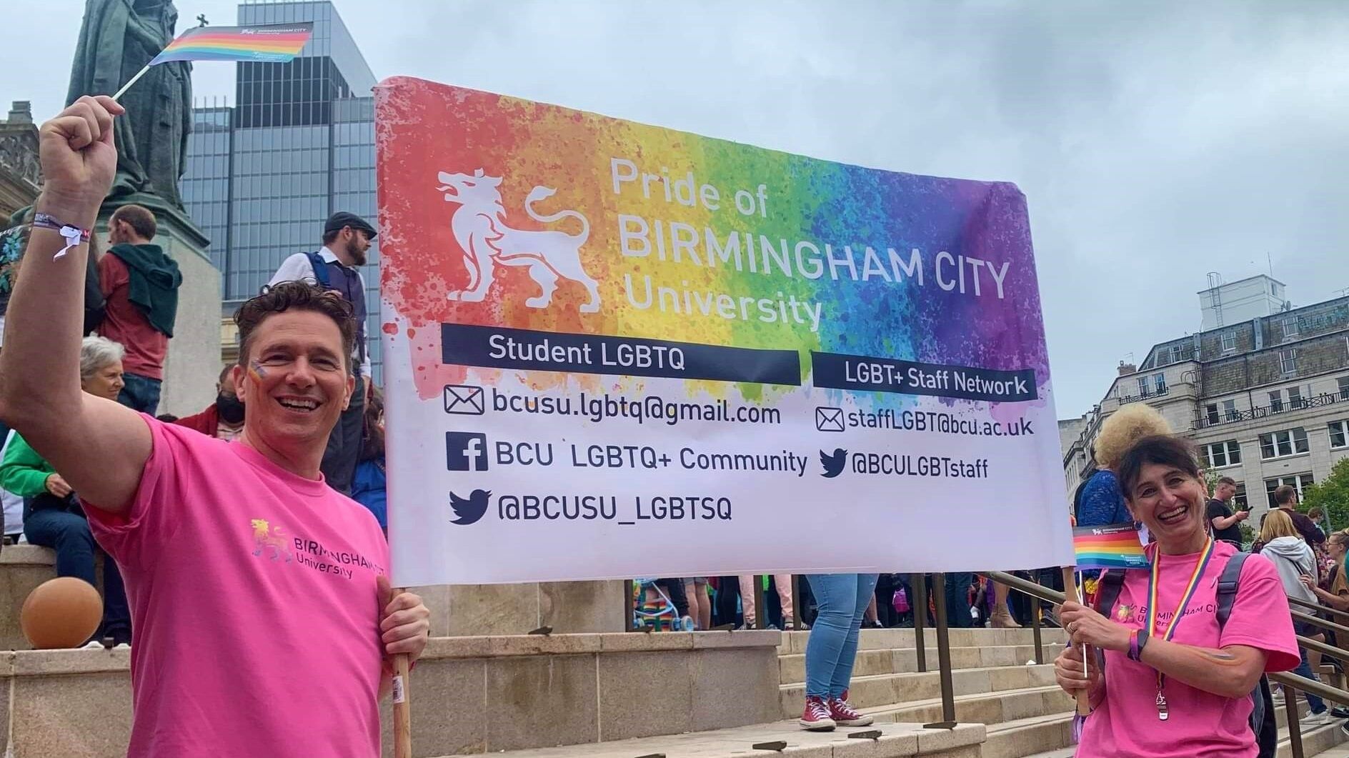 91���� at Pride holding banner
