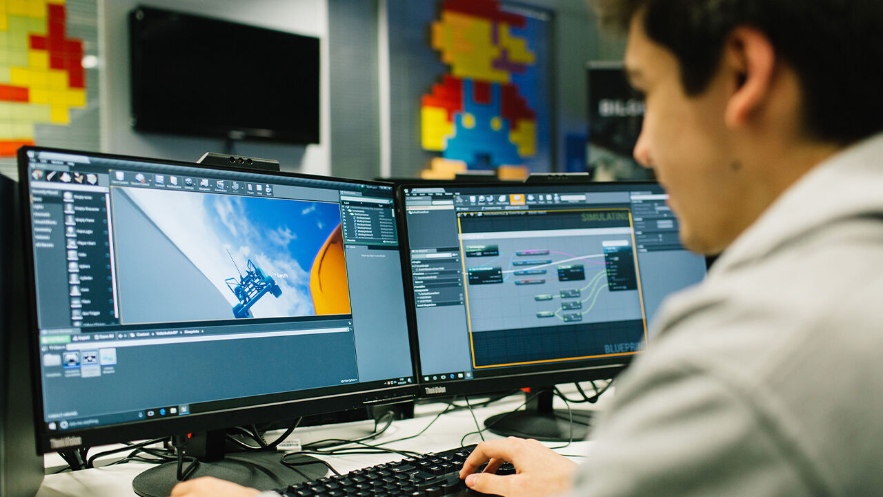 Student using games software, using simulator