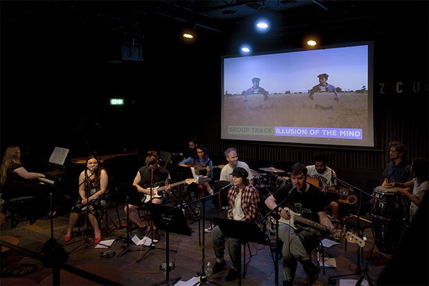 Young people performing music on stage