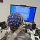 Child wearing EEG cap