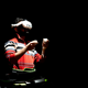 A man is playing on an omni-directional treadmill while wearing a VR headset