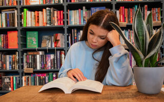 A female student reading a book