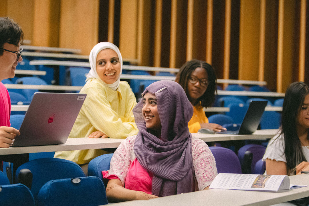 Students talking in a lecture theatre