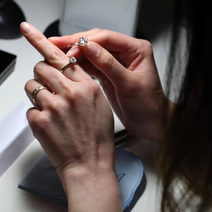 A person comparing rings