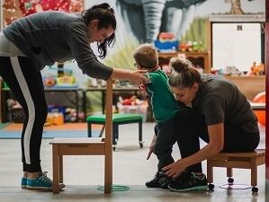 Conductive Education students working with child