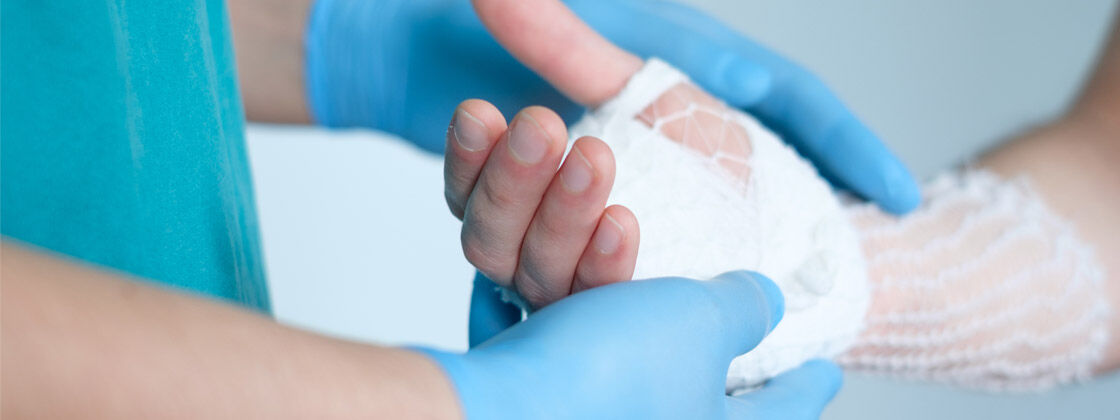 Nurse wrapping patients wound with bandage