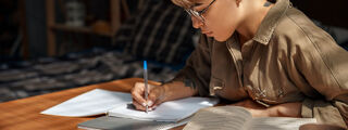 A woman taking part in a writing session